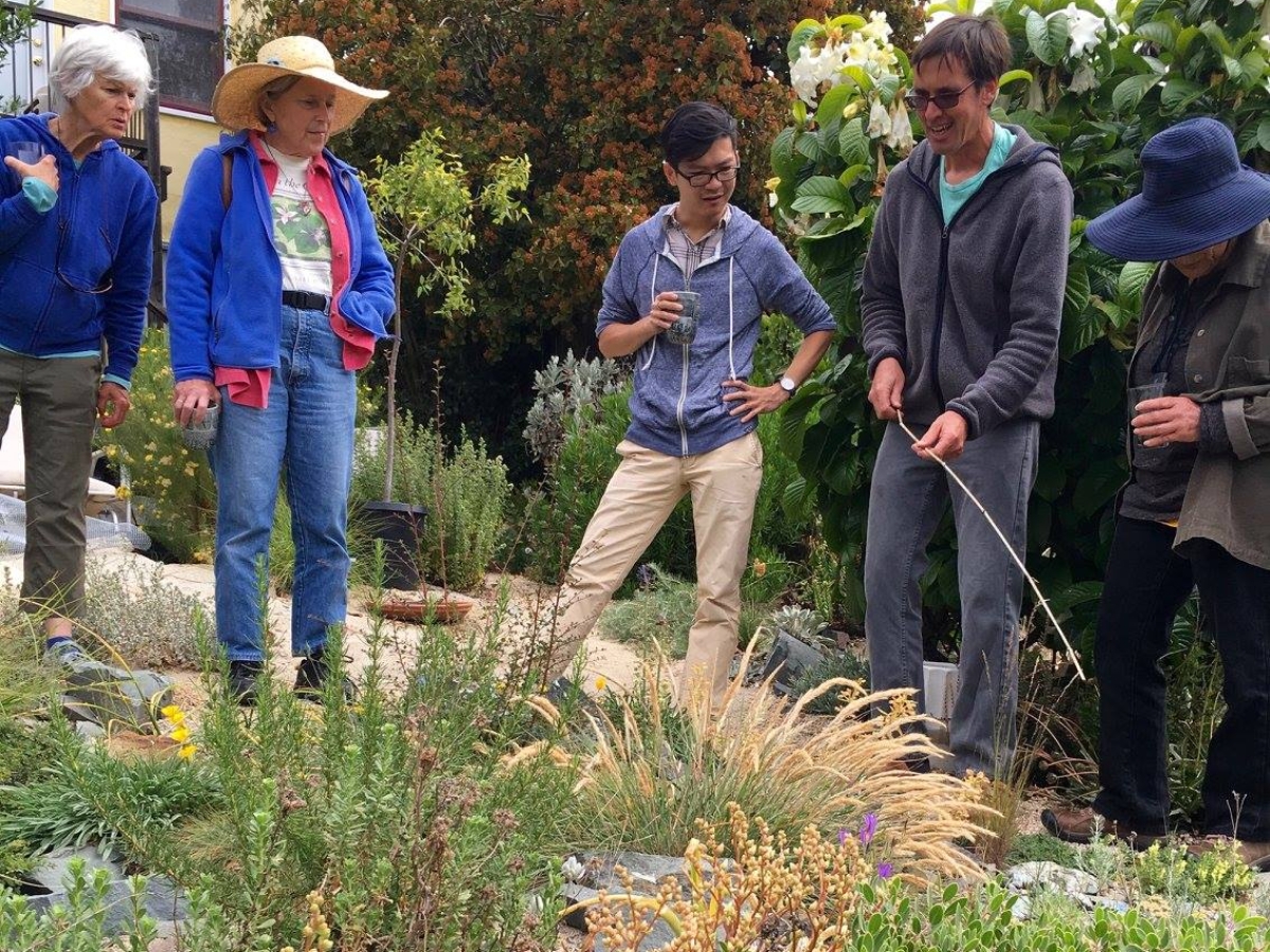Archie explains his serpentine rock garden to Cal Hort visitors